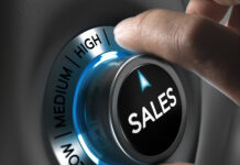 Sales button pointing the highest position with two fingers, blue and grey tones, Conceptual image for sales strategyor performance